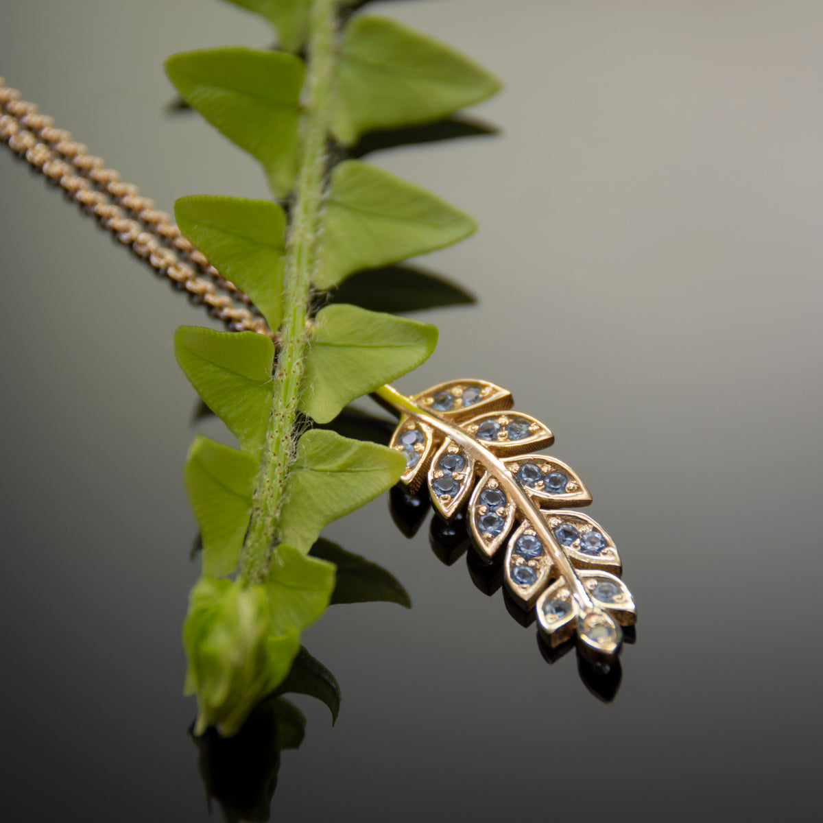NG4754A Gold Y Necklace with Leaf Pendant and Topaz