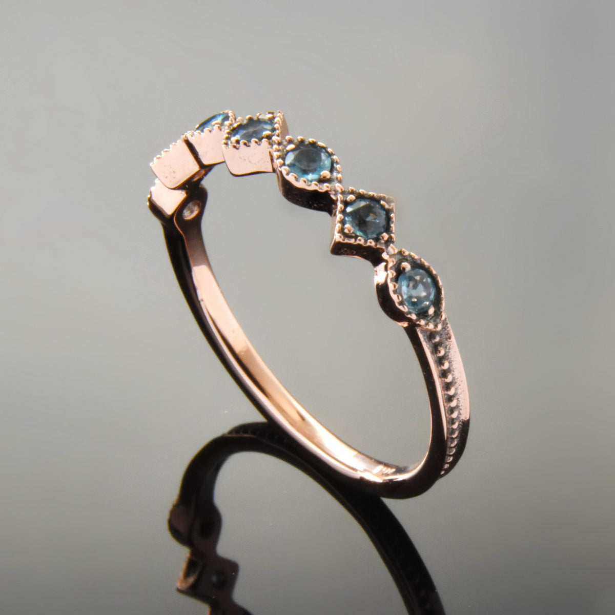 RG1813 Rose Gold Ring set with Blue Topaz stones