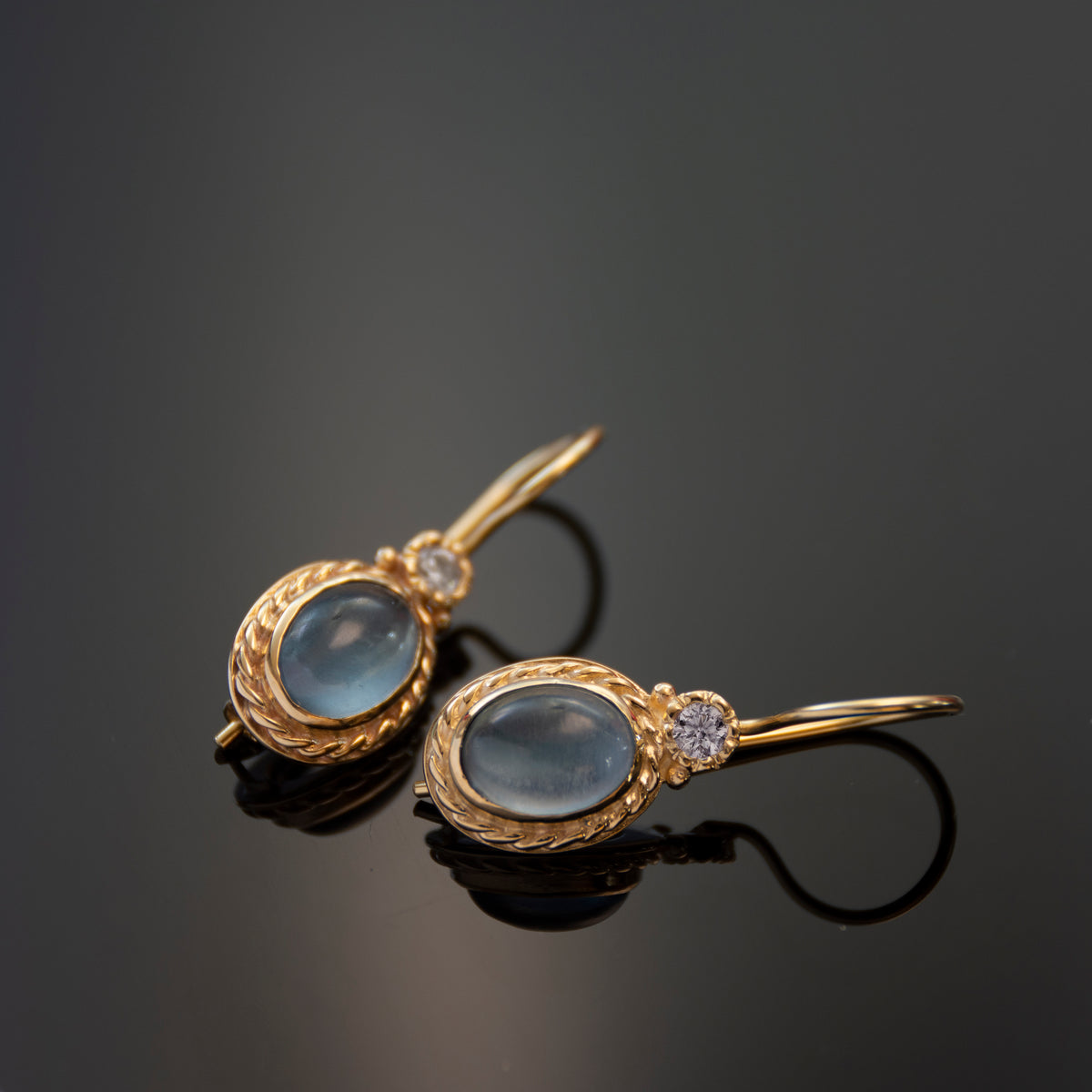 EG0732-1 Gold Drop Earrings with Oval Blue Topaz