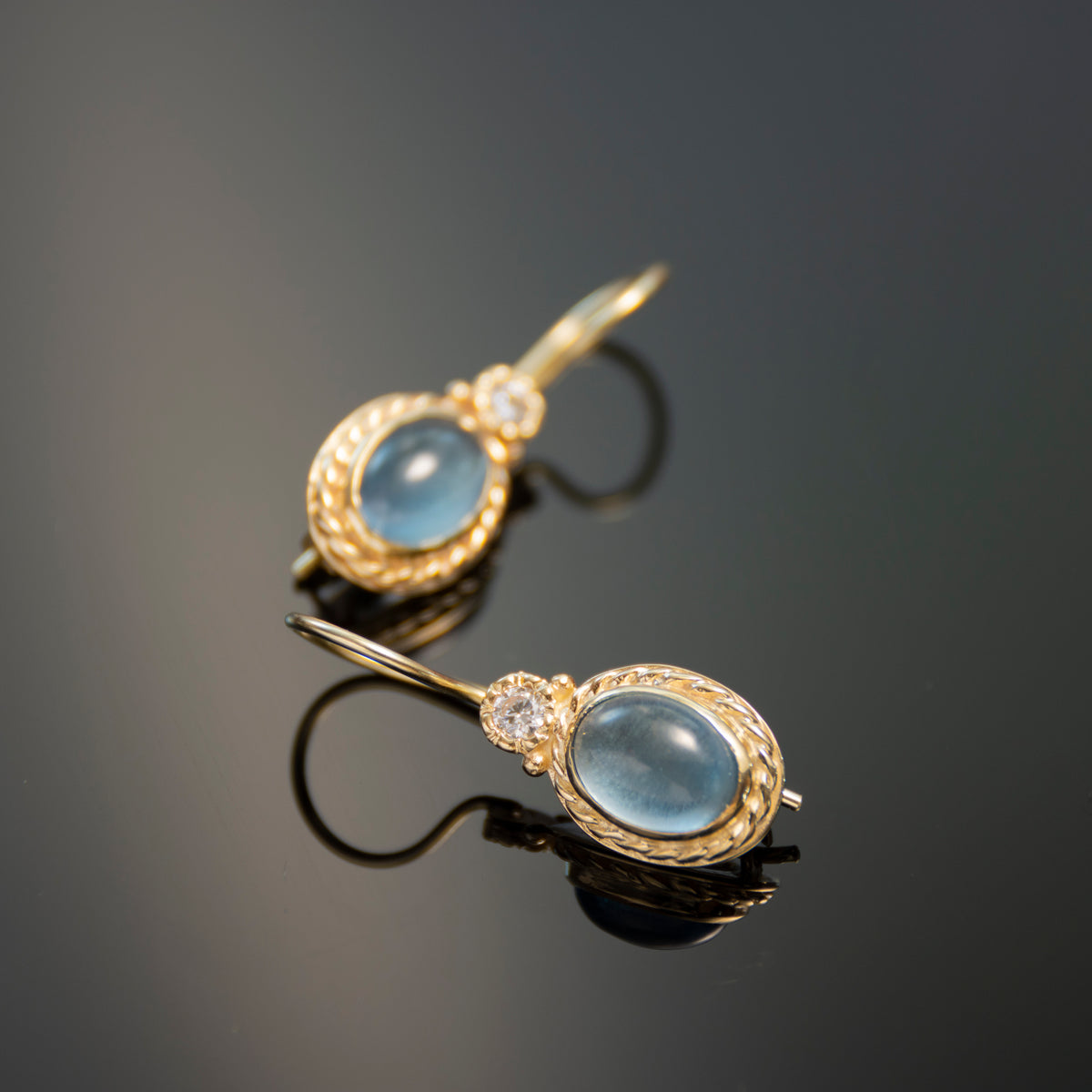 EG0732-1 Gold Drop Earrings with Oval Blue Topaz