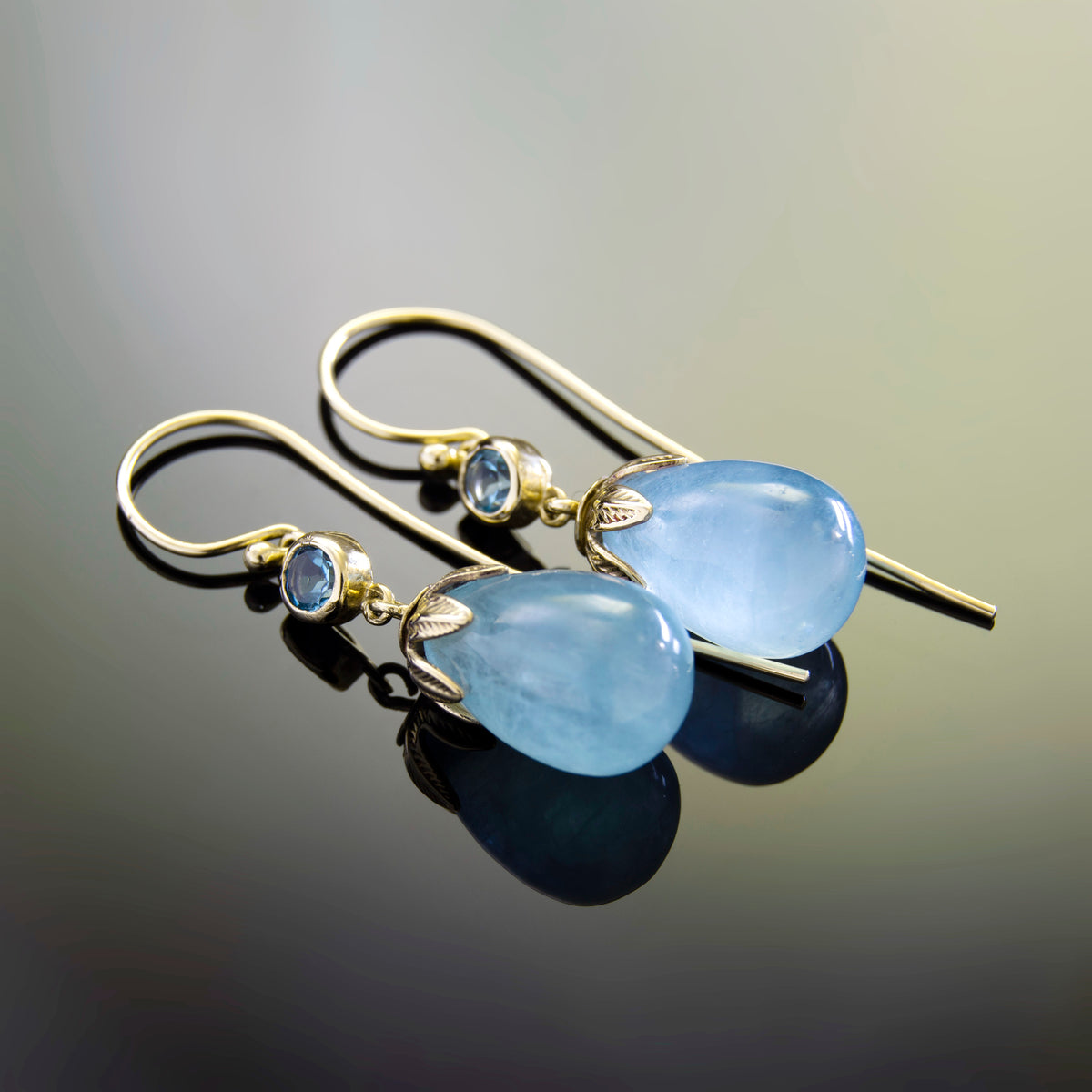 EG0759B Gold Drop Earrings with Aquamarine and Topaz in Leaf Crown Design