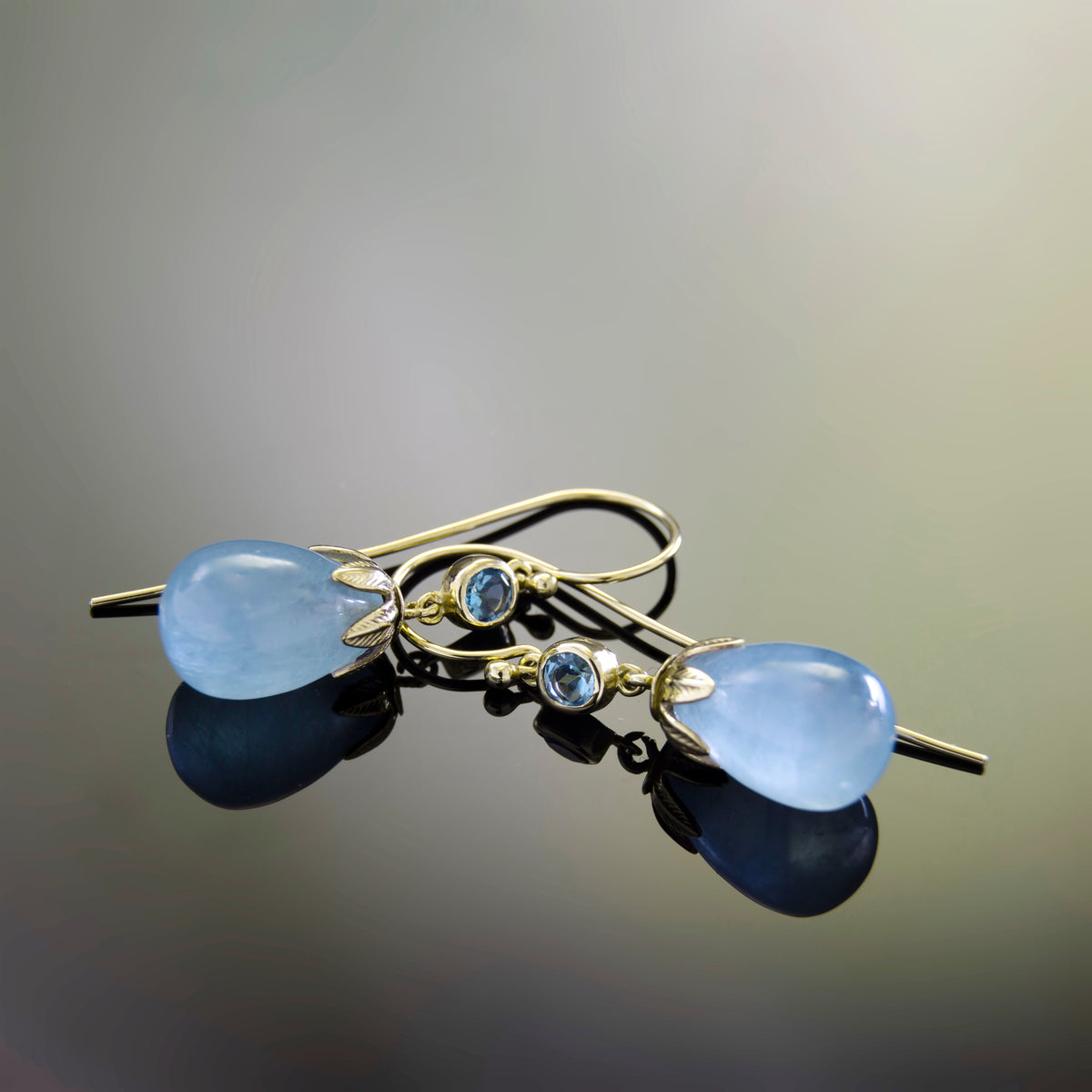 EG0759B Gold Drop Earrings with Aquamarine and Topaz in Leaf Crown Design