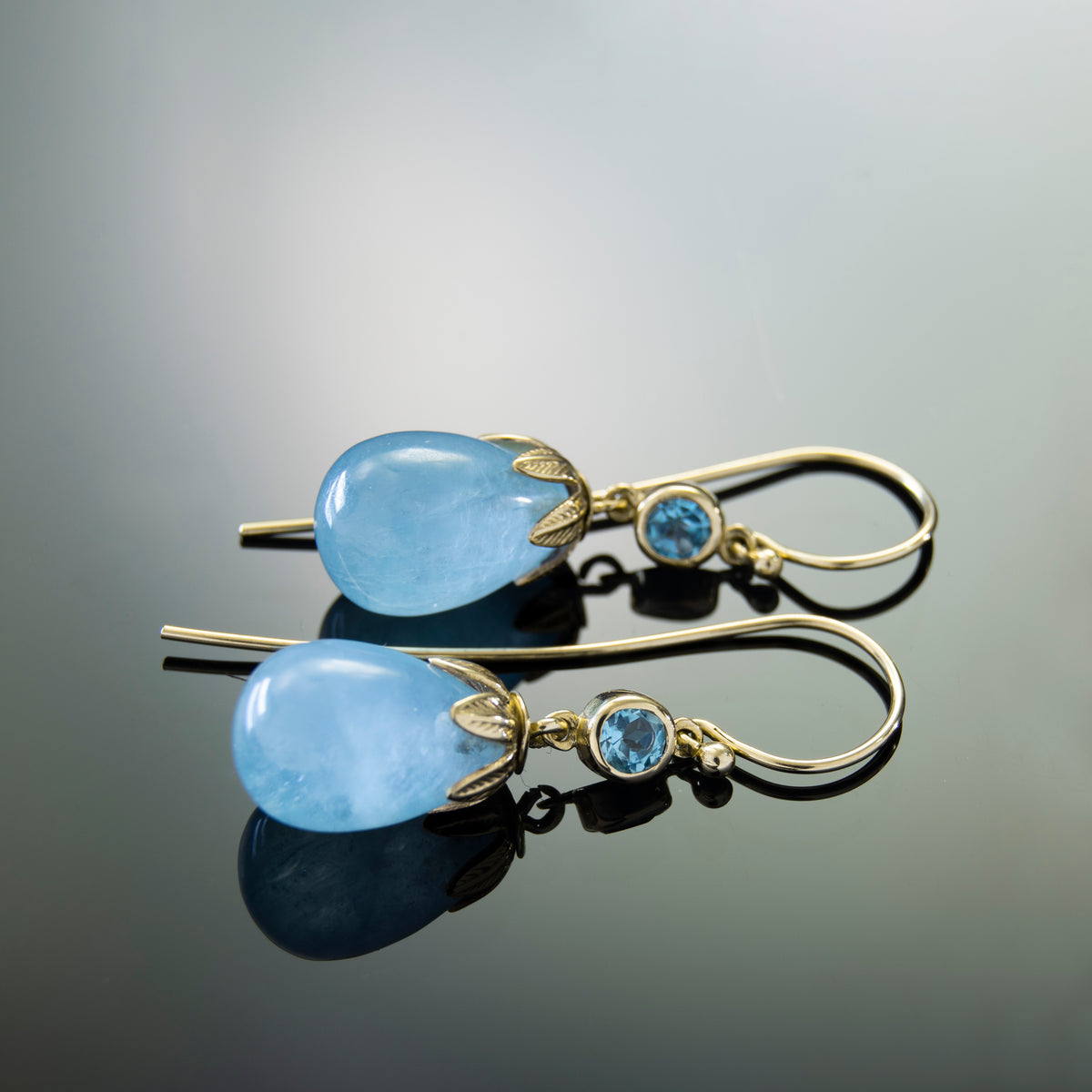 EG0759B Gold Drop Earrings with Aquamarine and Topaz in Leaf Crown Design