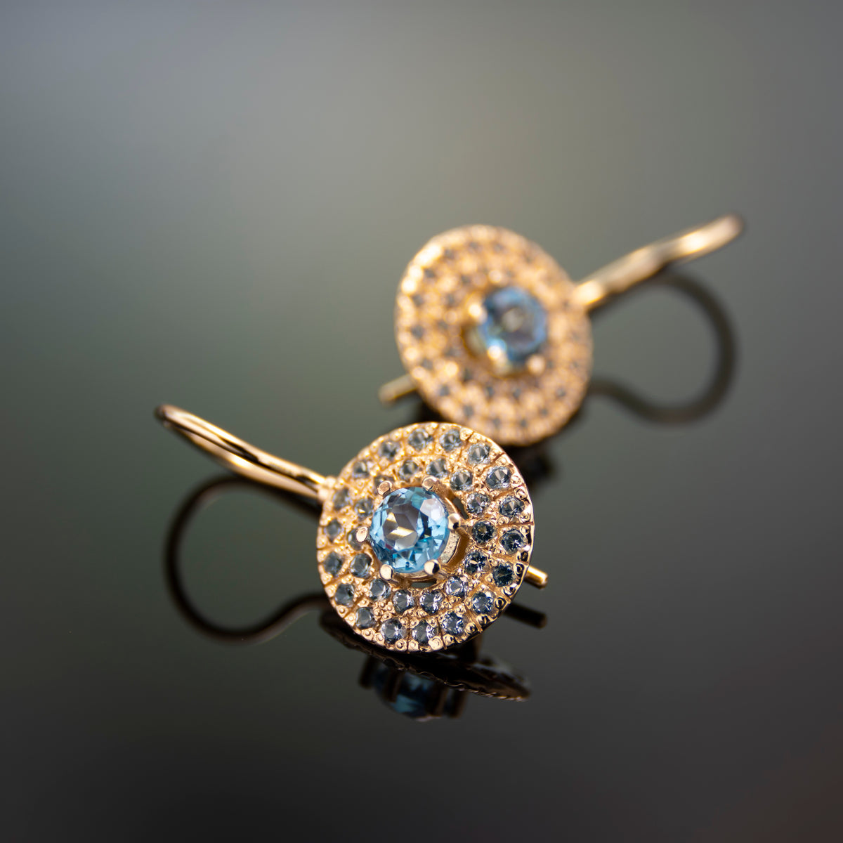 EG2245-1 Round Gold drop earrings with Blue Topaz stones set in a circle