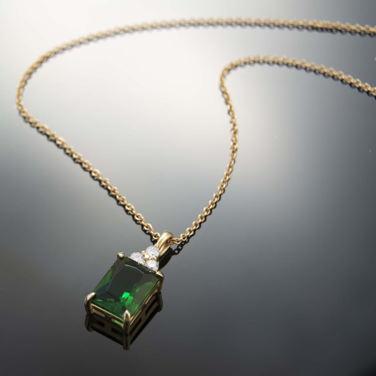 NG4792 Classic Gold Pendant Necklace With Stunning Emerald-Cut Green Emerald And Sparkling Diamond Accents - Elegant Everyday Luxury Jewelry