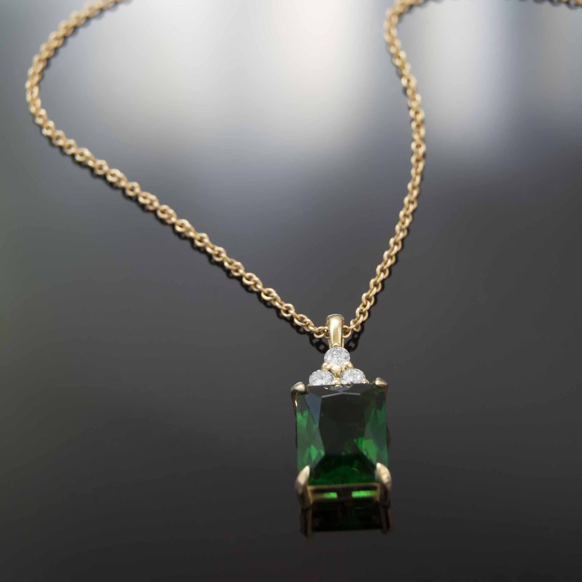 NG4792 Classic Gold Pendant Necklace With Stunning Emerald-Cut Green Emerald And Sparkling Diamond Accents - Elegant Everyday Luxury Jewelry