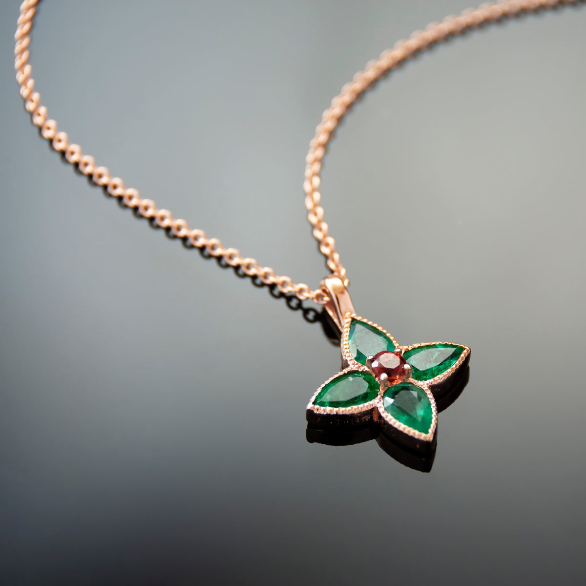 NG4797-1 Rose Gold Clover Pendant Necklace with Emerald and Garnet