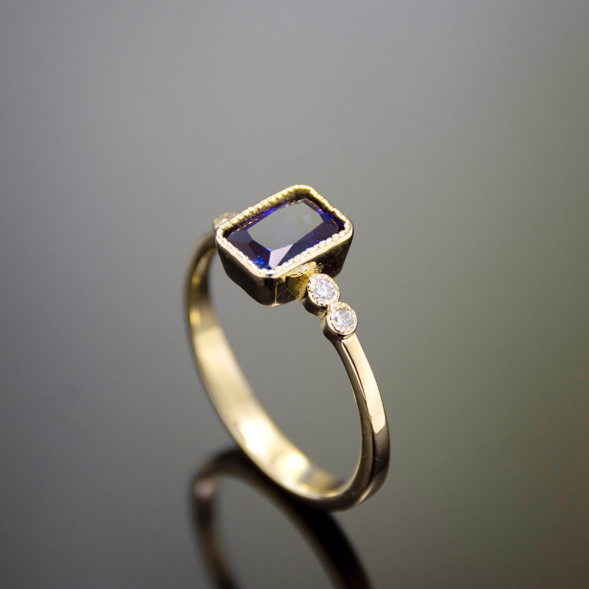 RG1834-2 Gold Ring with Square Blue Sapphire and Zircon Accents