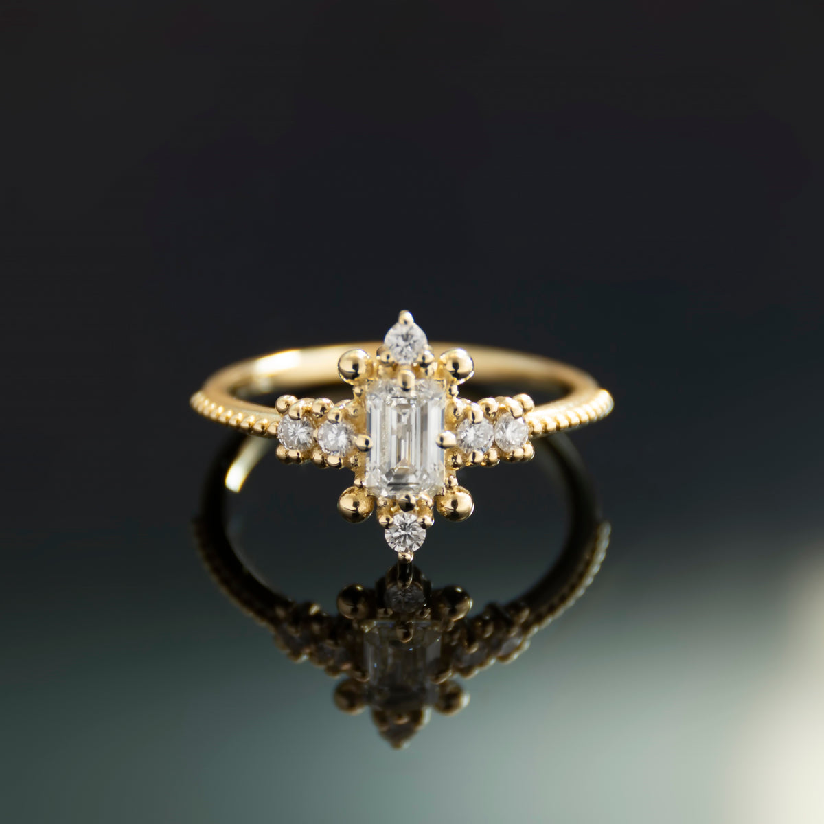 RG1914 Victorian-Inspired Gold Ring with Centered Emerald-Cut Diamond and Accent Diamonds