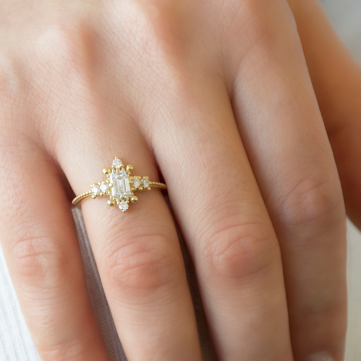 RG1914 Victorian-Inspired Gold Ring with Centered Emerald-Cut Diamond and Accent Diamonds