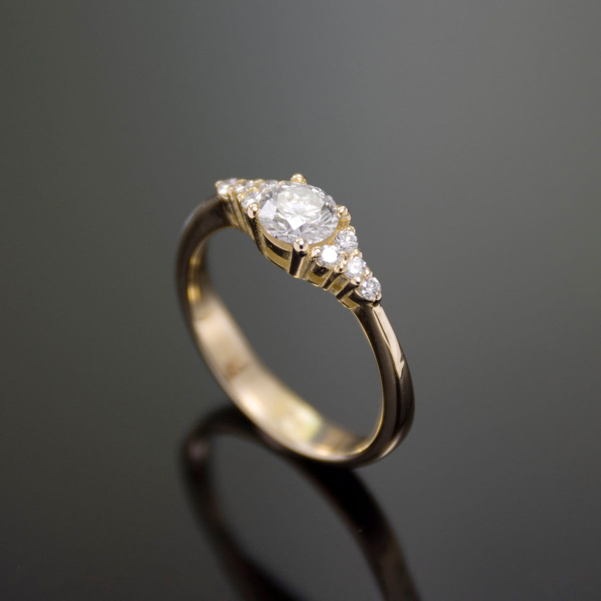 RG1924 Classic Minimalist Gold Ring with Central Diamond and Side Accent Diamonds