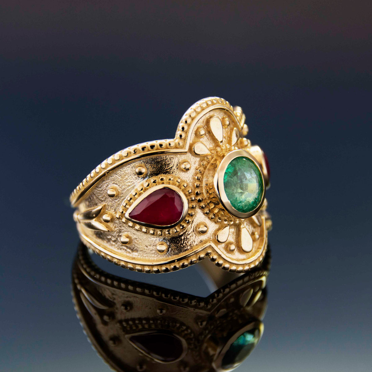 RG1934 Luxurious 14K Gold Statement Ring with Natural Emerald Centerpiece and Pear-Shaped Ruby Accents