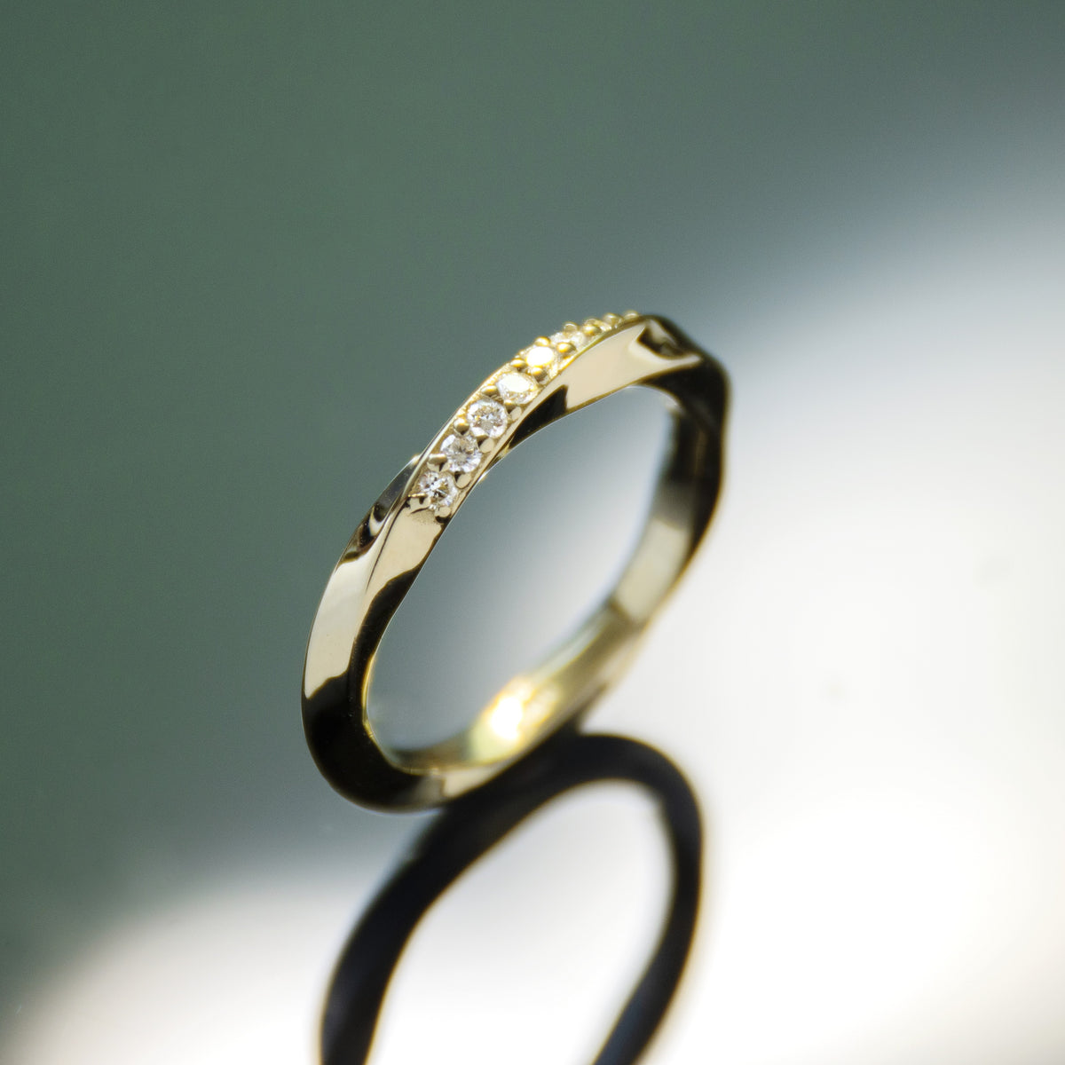 RG1935 Modern Mobius Twist Ring With Nine Sparkling Diamonds In Yellow Gold Band