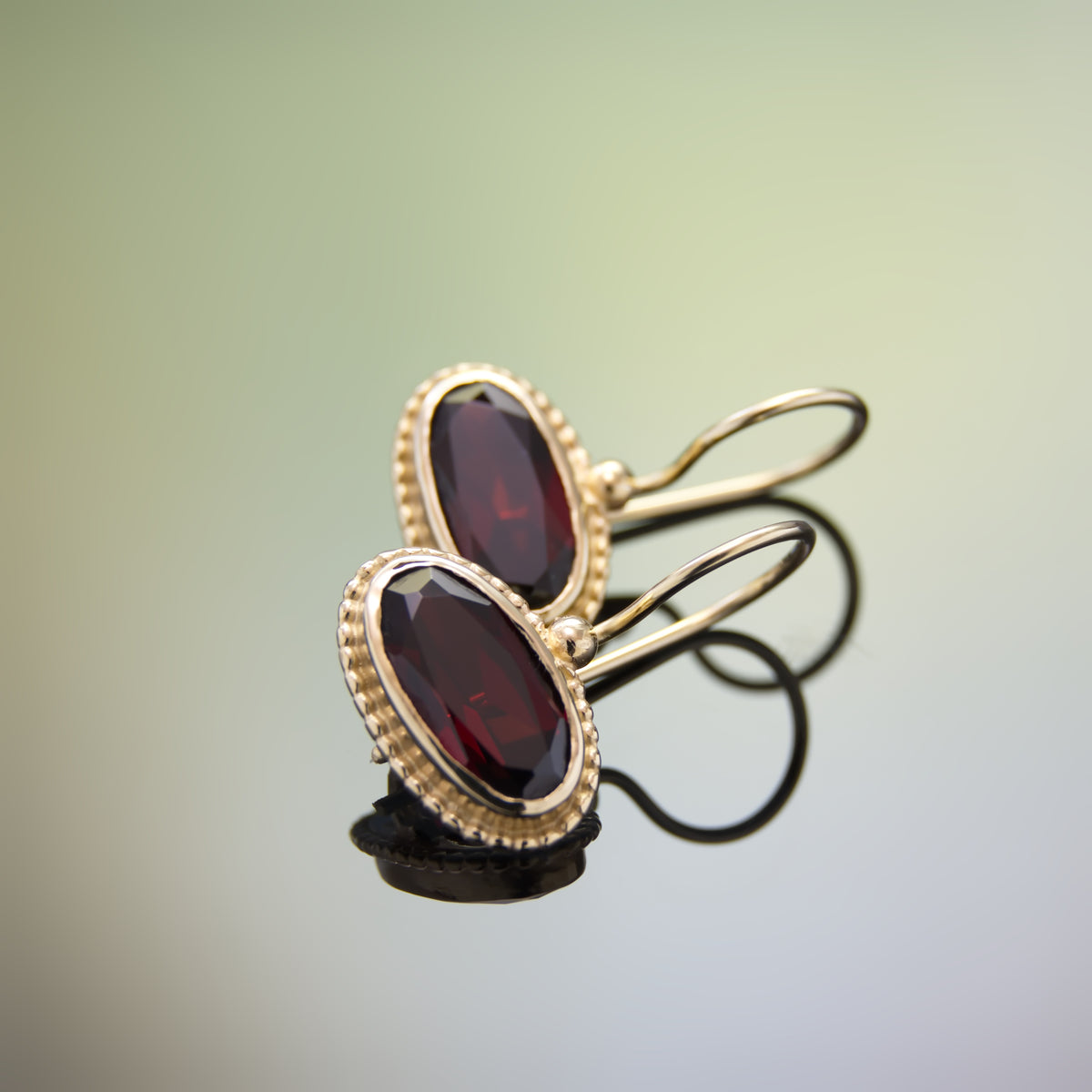 EG2218-2 Oval Gold Earrings with Garnet