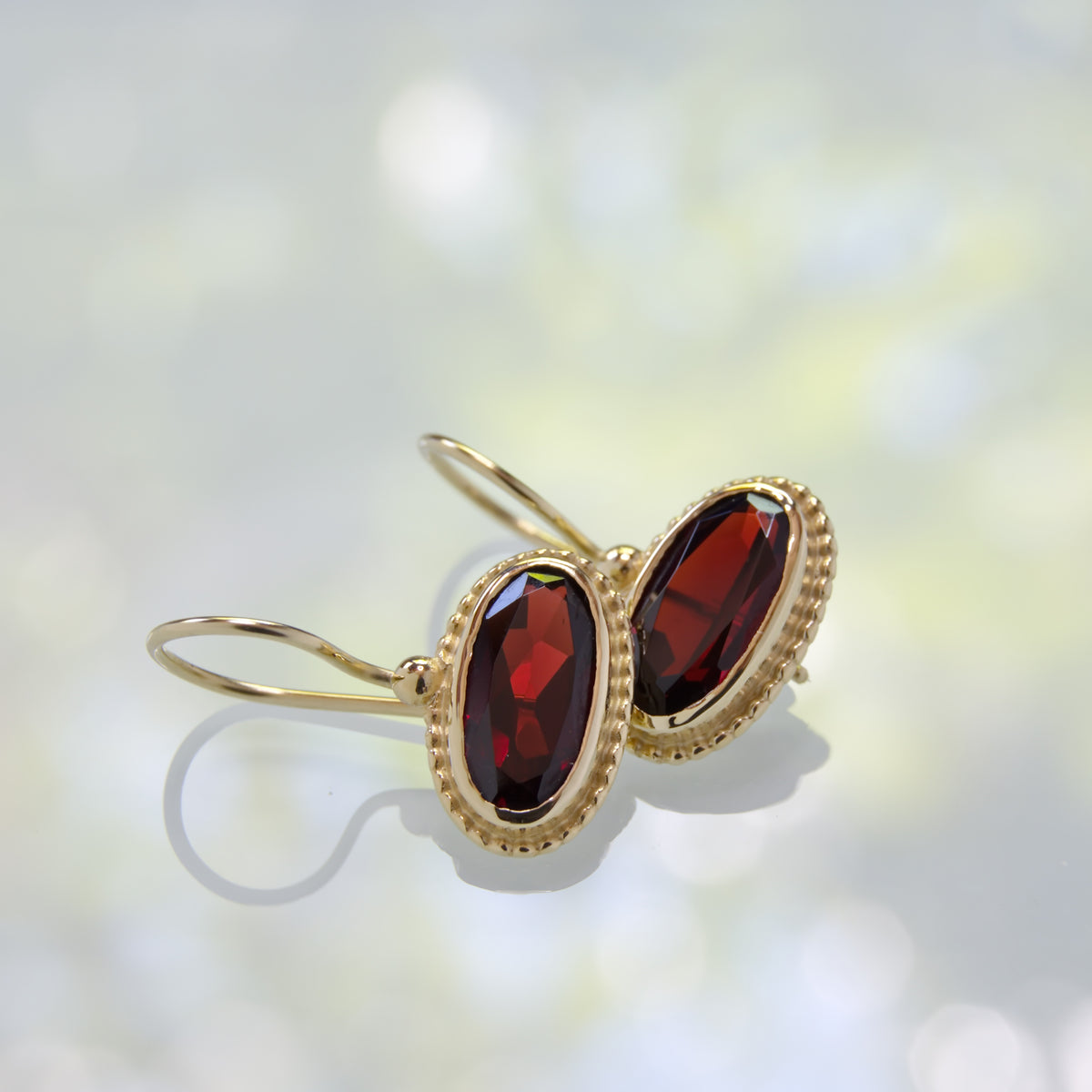 EG2218-2 Oval Gold Earrings with Garnet