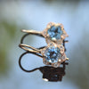 EG2228 Gold Flower Earrings with Blue Topaz