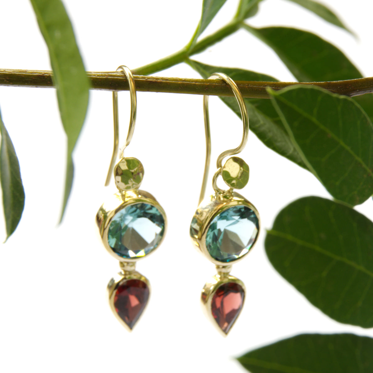 EG2233 Gold drop earrings with Blue Topaz and Garnet