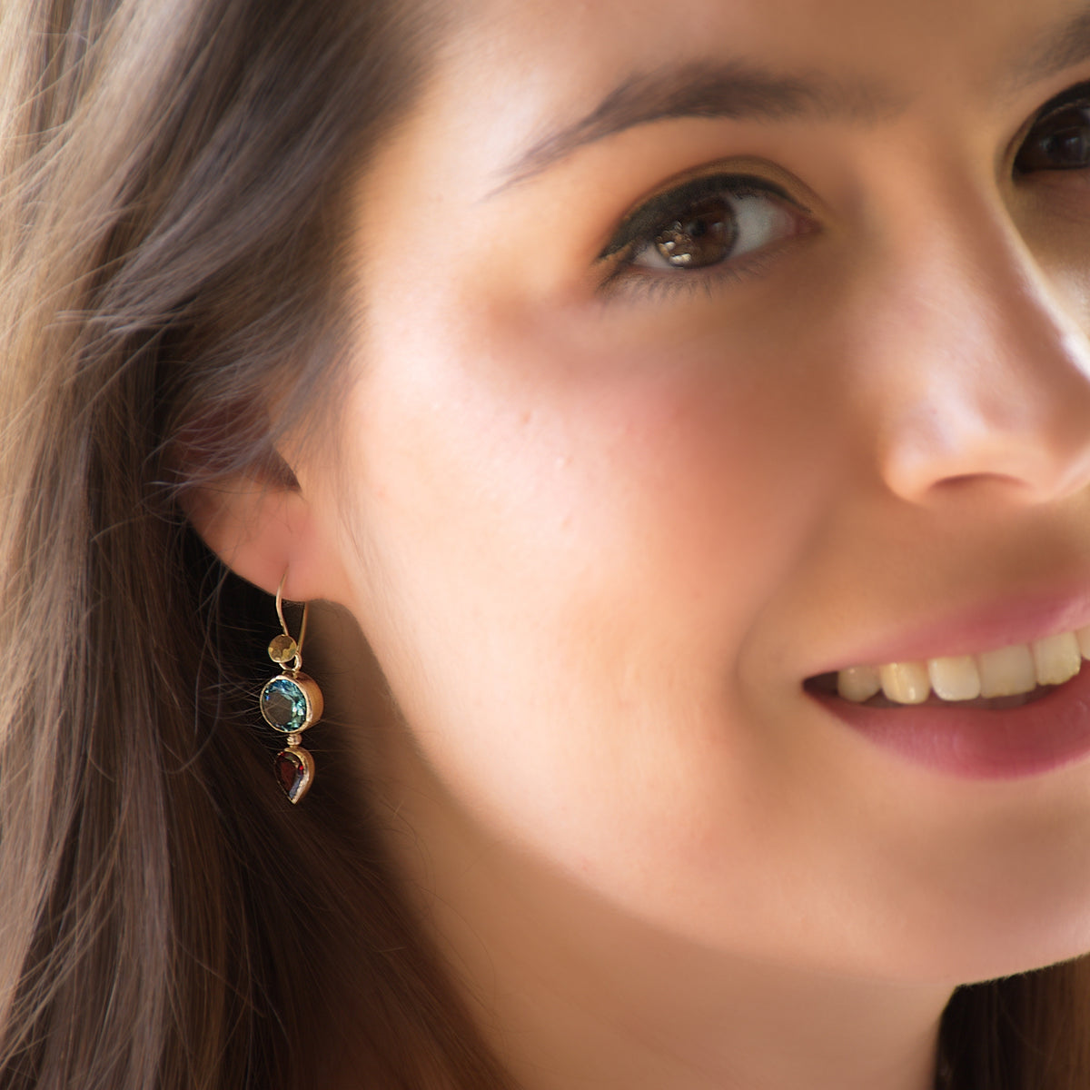 EG2233 Gold drop earrings with Blue Topaz and Garnet