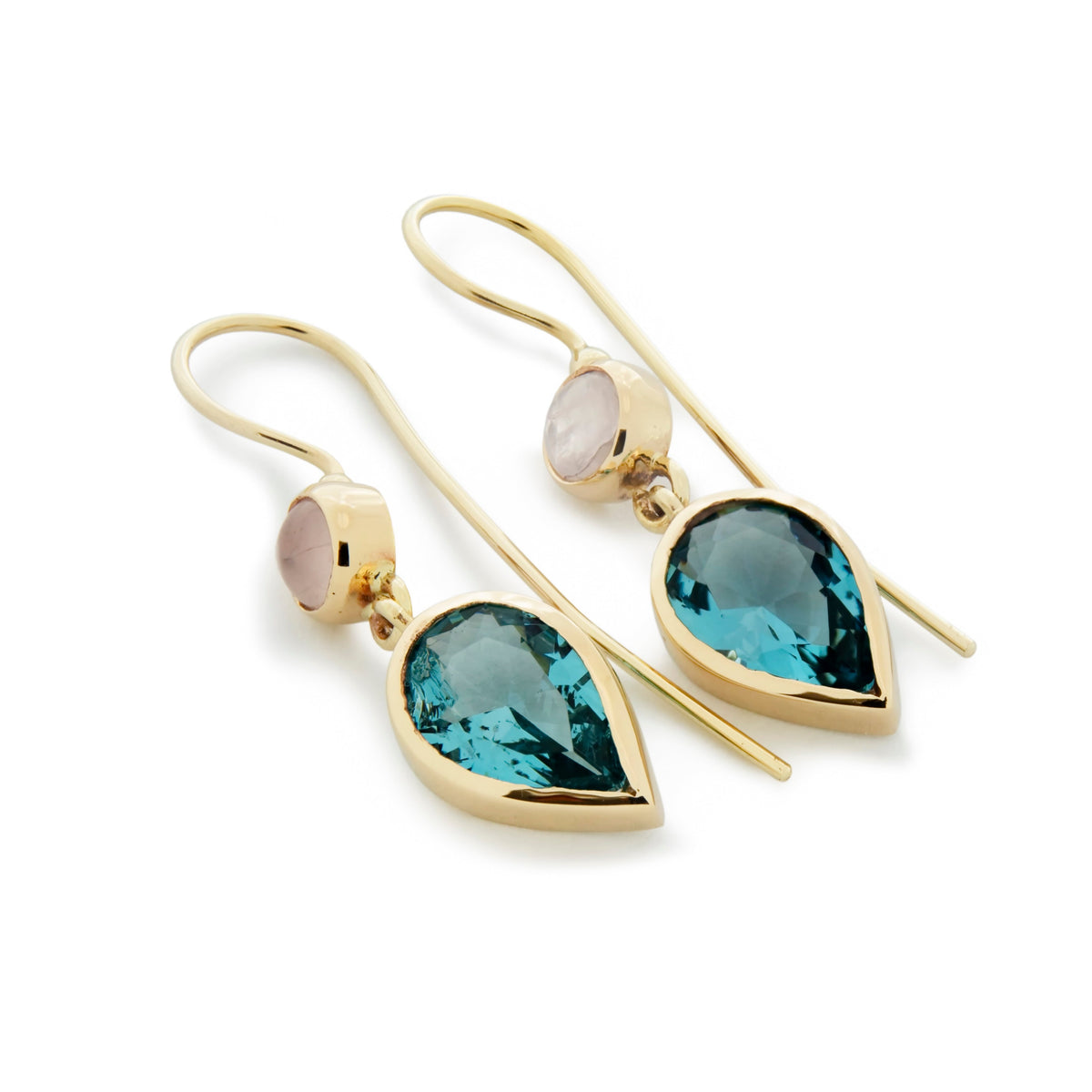 Rose Quartz and the captivating allure of Teardrop Blue Topaz. A harmonious blend of color and style.