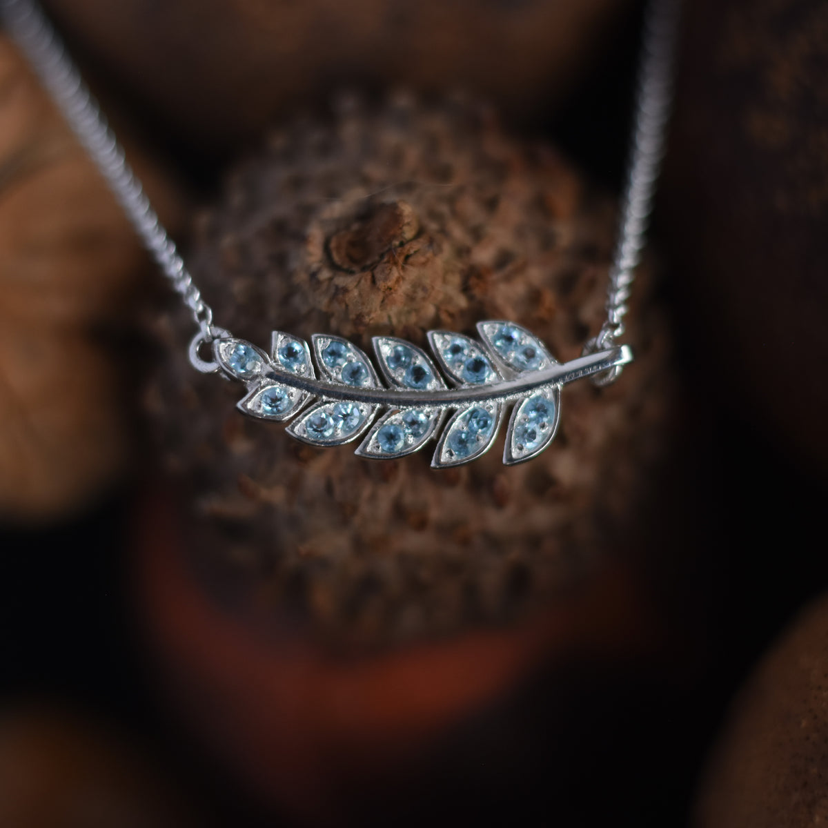 NG4754-2 White gold and Topaz leaf pendant necklace