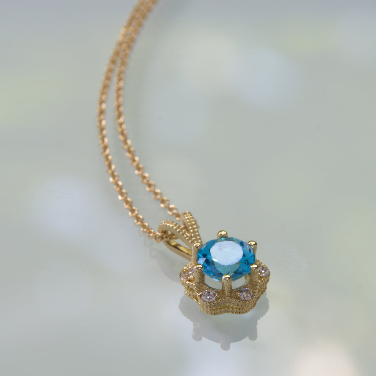 NG4757-1 Gold Necklace with Blue Topaz and Diamonds Flower Pendant