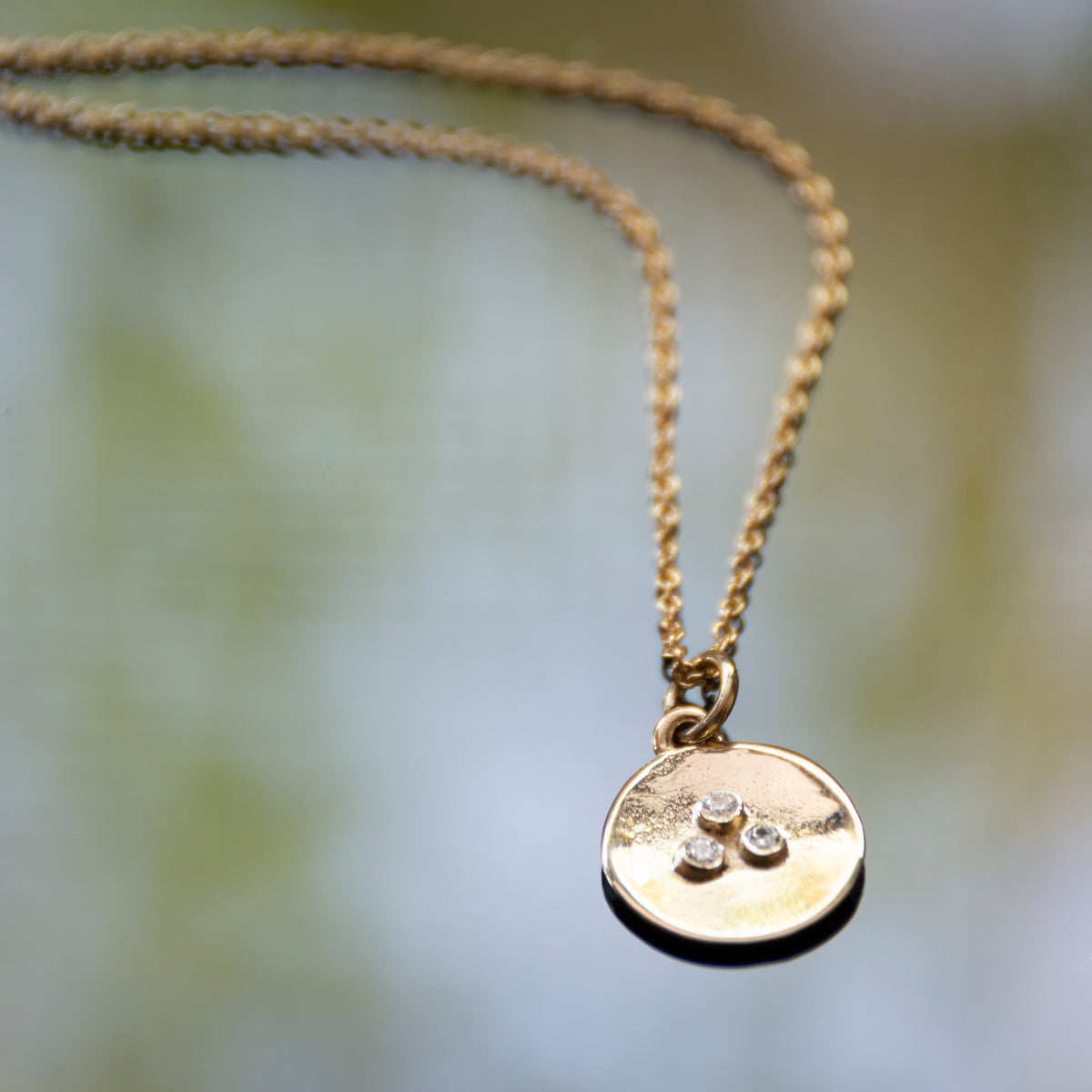 NG4767A Gold Round Charm Necklace with Three Diamonds