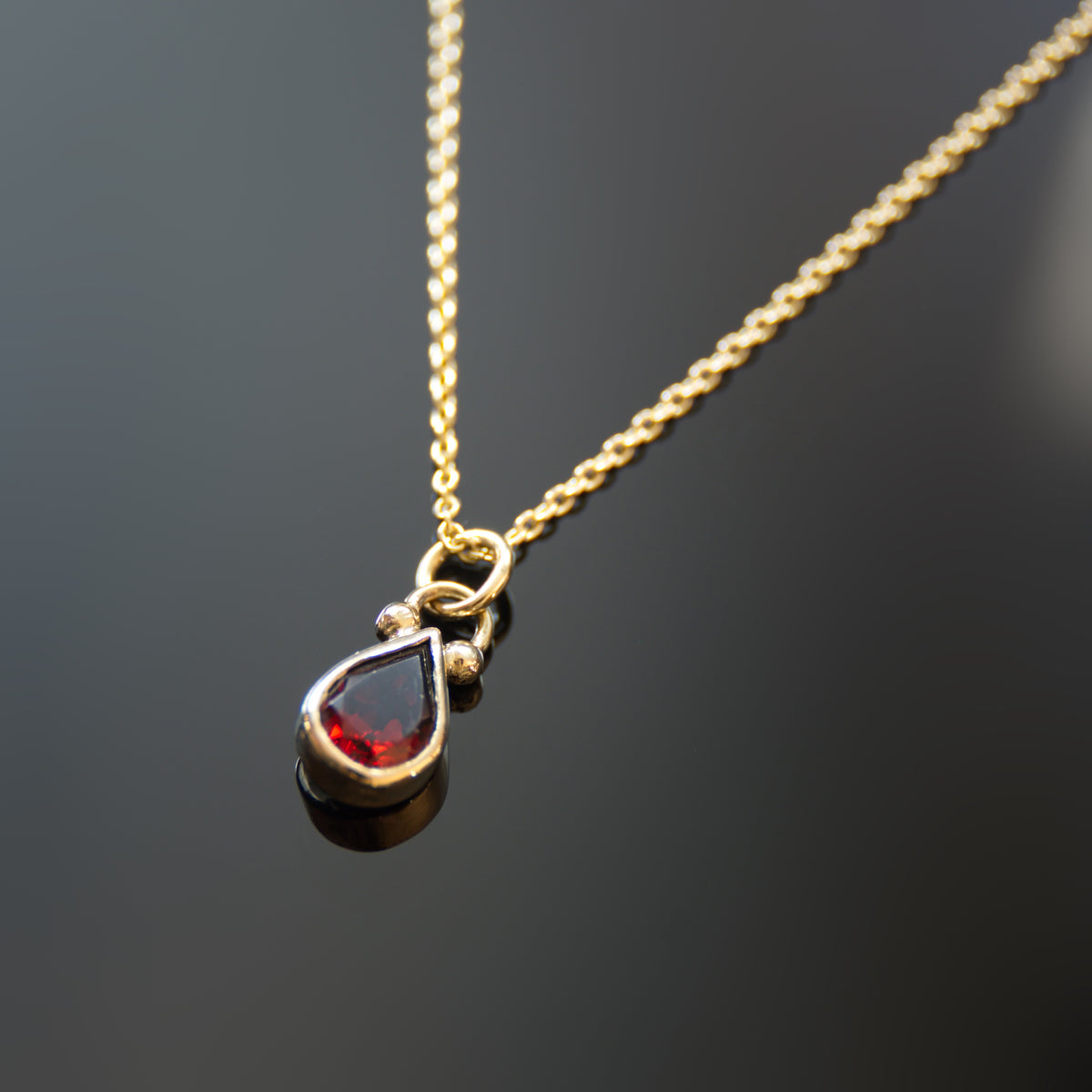 NG4768 Gold Necklace with Teardrop Garnet Pendant