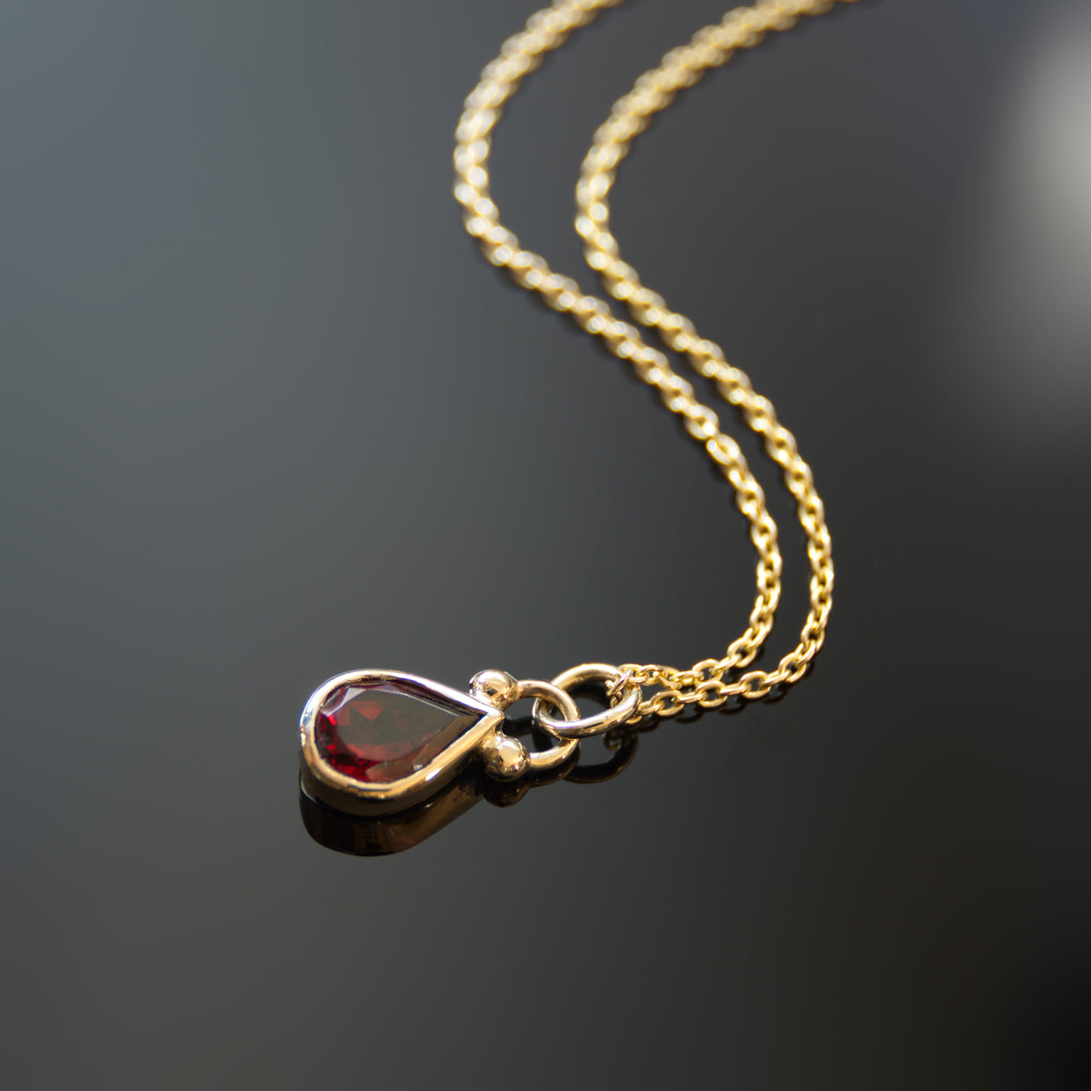 NG4768 Gold Necklace with Teardrop Garnet Pendant