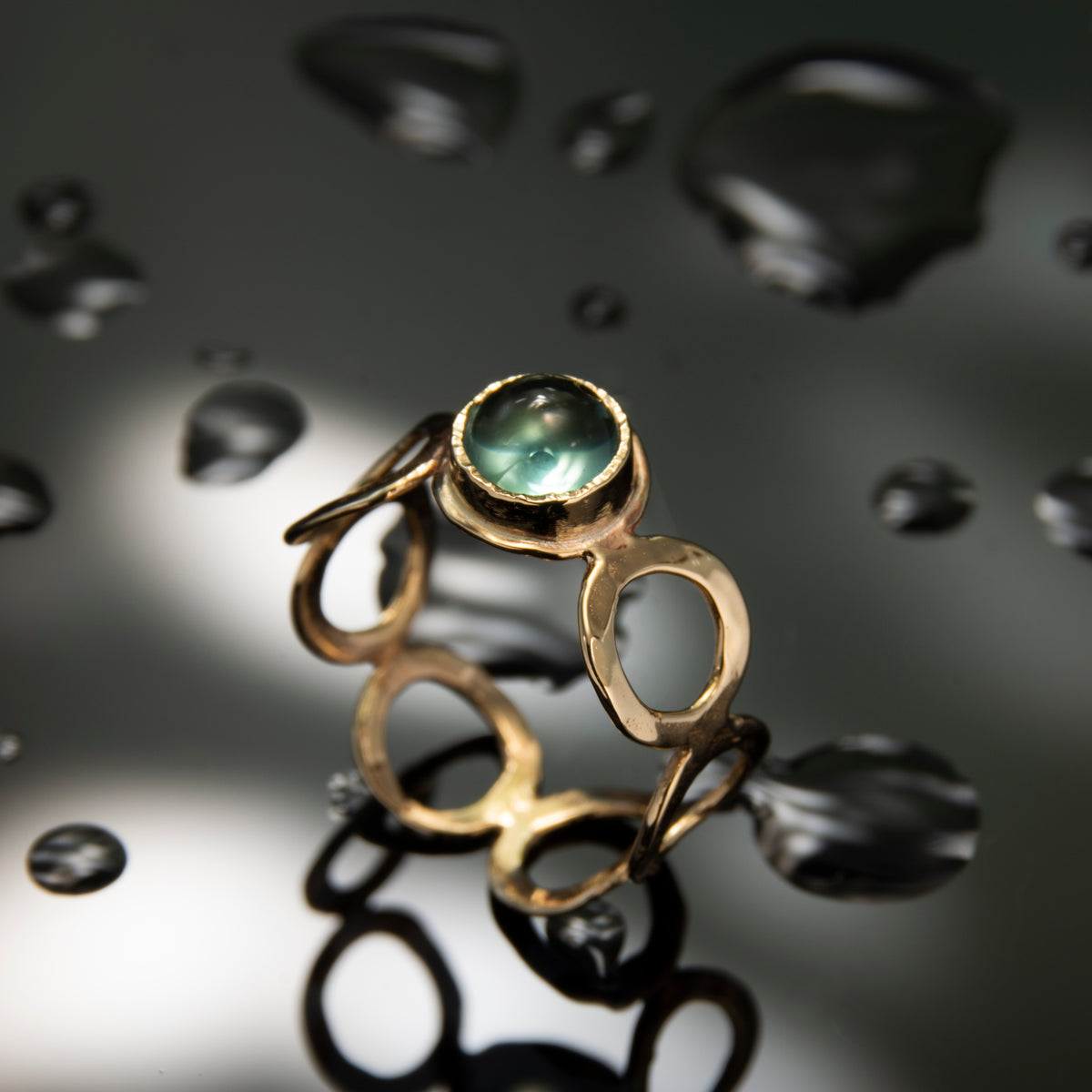 RG1266X-1 Gold Circles Ring with Blue Topaz