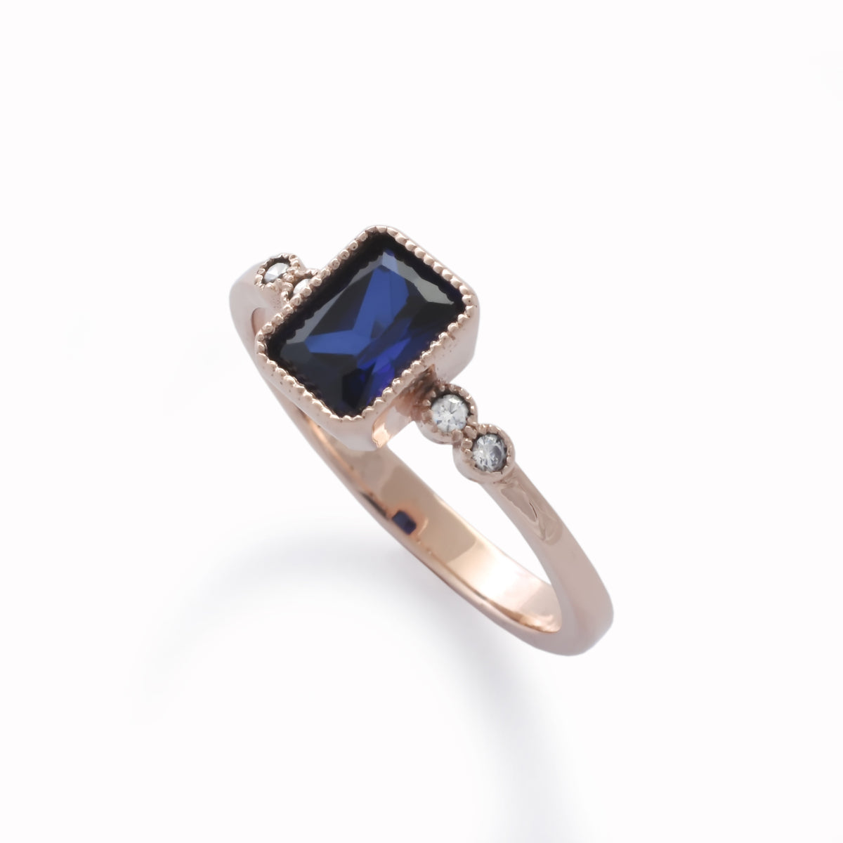 RG1834-2 Rose Gold Ring with Square Blue Sapphire and Zircon Accents