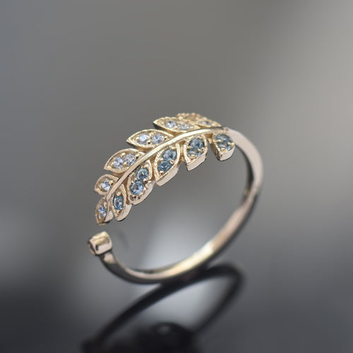 RG1835-2   Gold and Topaz open leaf ring