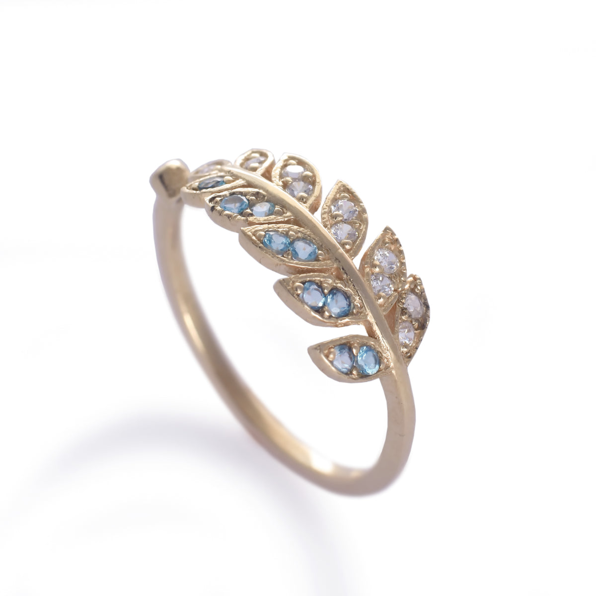 RG1835-2   Gold and Topaz open leaf ring