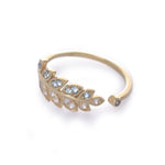 RG1835-2   Gold and Topaz open leaf ring