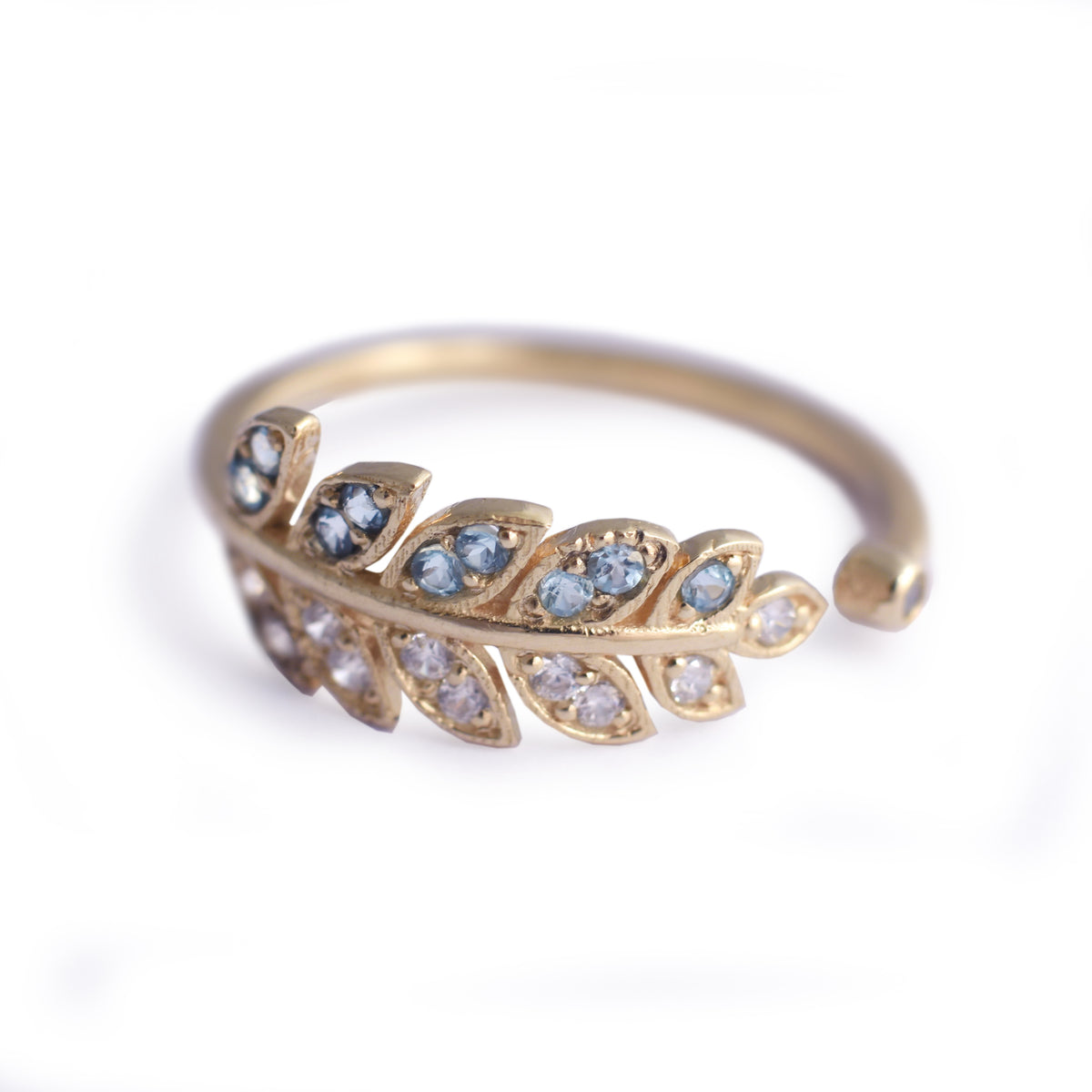 RG1835-2   Gold and Topaz open leaf ring