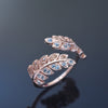 RG1836-1   Open leaves ring with Topaz and CZ
