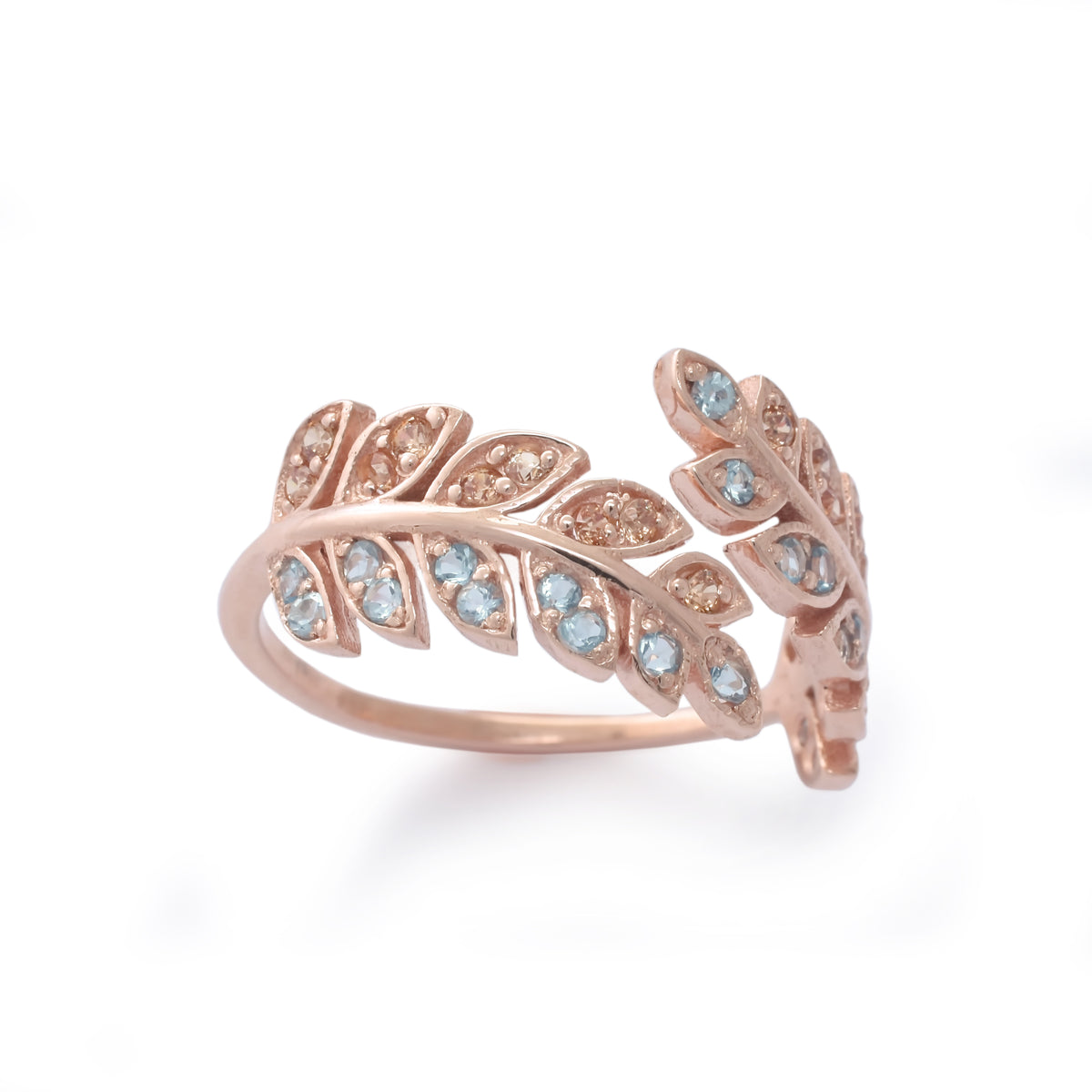 RG1836-1   Open leaves ring with Topaz and CZ