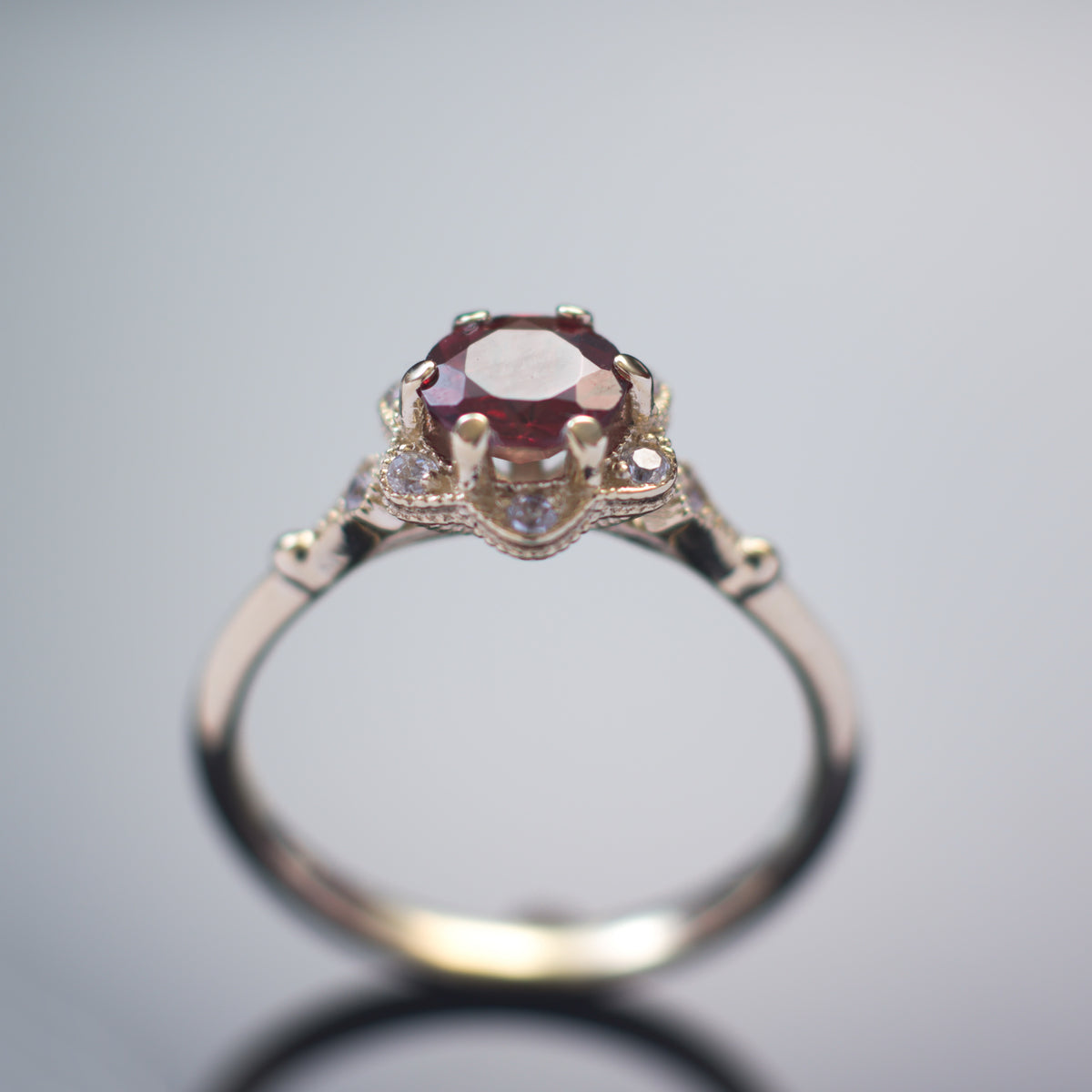 RG1854 Gold flower ring with Garnet and CZ