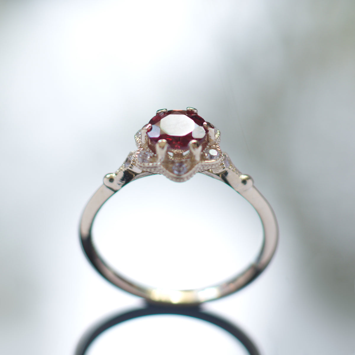 RG1854 Gold flower ring with Garnet and CZ