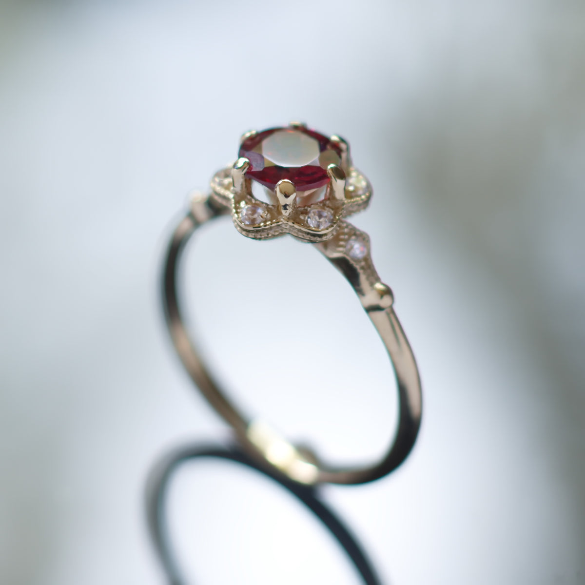 RG1854 Gold flower ring with Garnet and CZ