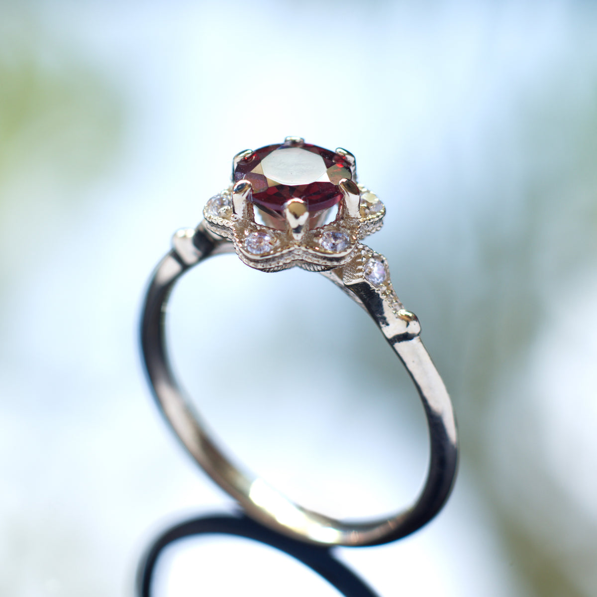 RG1854 Gold flower ring with Garnet and CZ