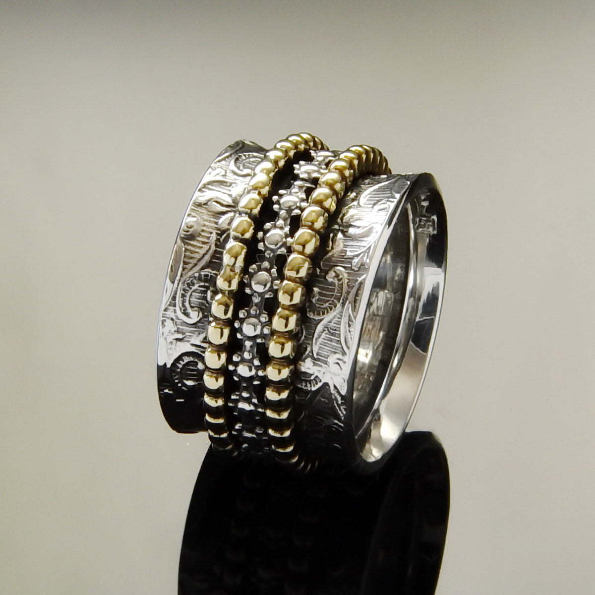 R1209J Spinner Ring with Textured Floral and Dotted Design