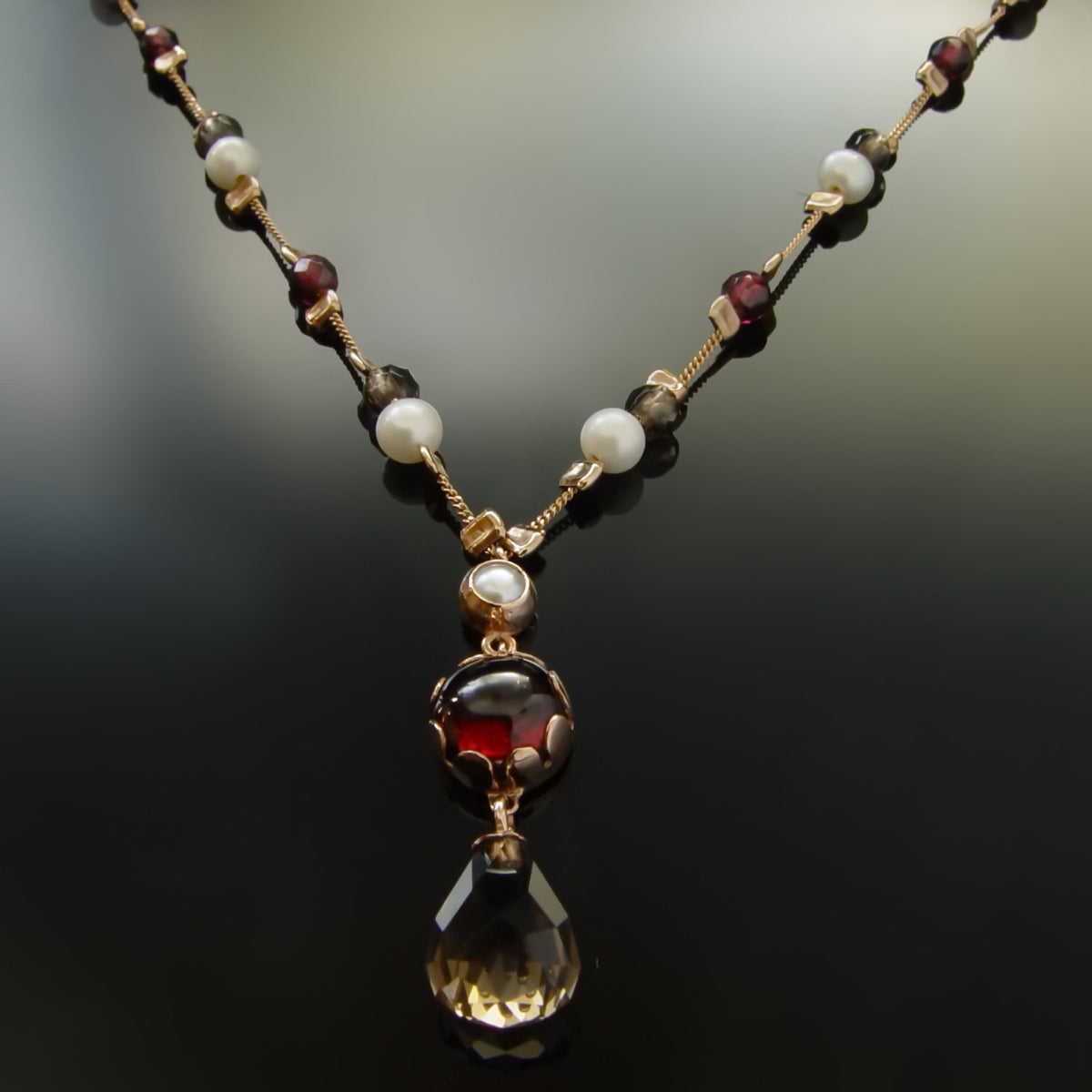 NG0862-1 Gold station necklace with Garnet, Pearls and Smokey Quartz