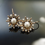 EG7701 Gold flower earrings with pearls