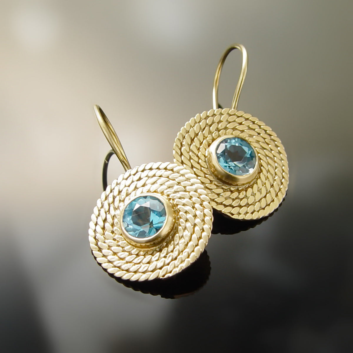 EG0761-1 Gold Braided earrings with Topaz