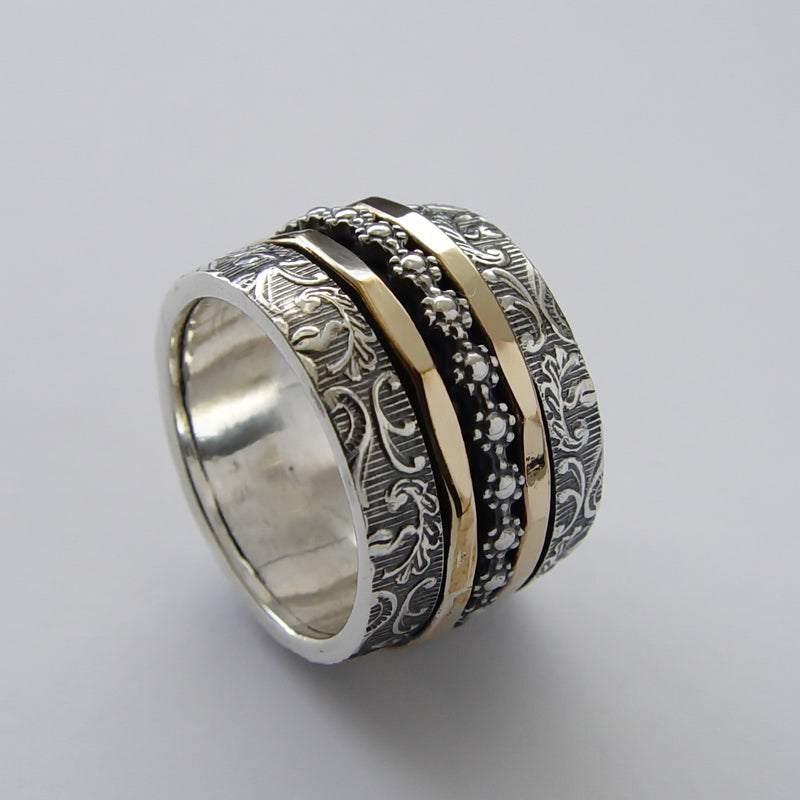 R1794 Wide multi spinner floral ring