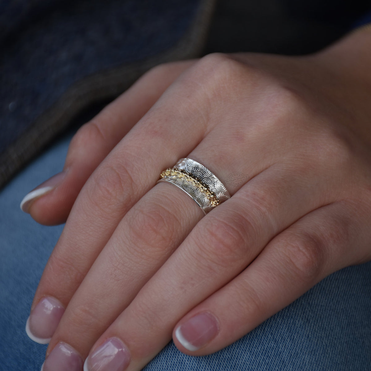 R1196 Mixed pattern Silver and Brass spinner ring