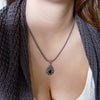 N0459 Mixed metals teardrop pendant necklace with green Quartz
